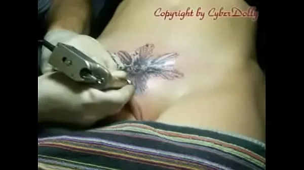 Big tattoo created on the vagina top Clips