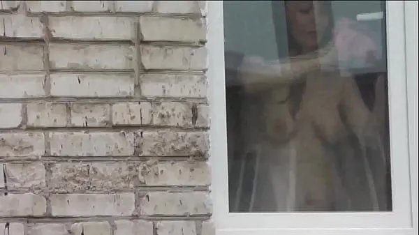 Stora Naked in public. Nude. Outdoor. Outside. Husband Sexy Frina is spying on her from car window when she washes apartment window no panties and bra toppklipp